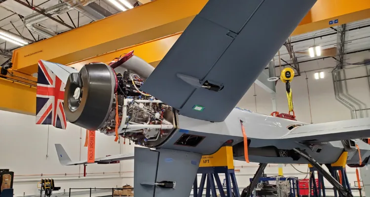 A plane in a factoryDescription automatically generated