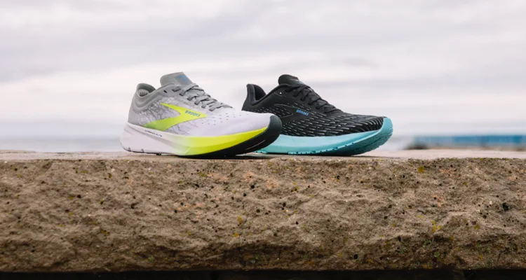 A pair of shoes on a ledgeDescription automatically generated