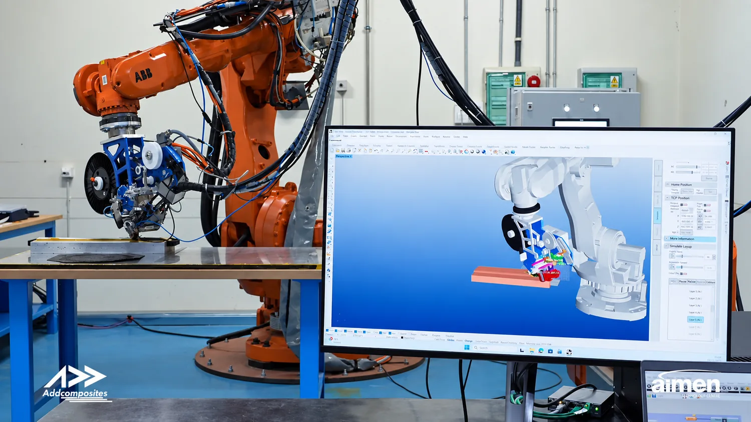 AddPath running a layup simulation on the digital twin (right) beside the ABB robot and AFP head it models (left).