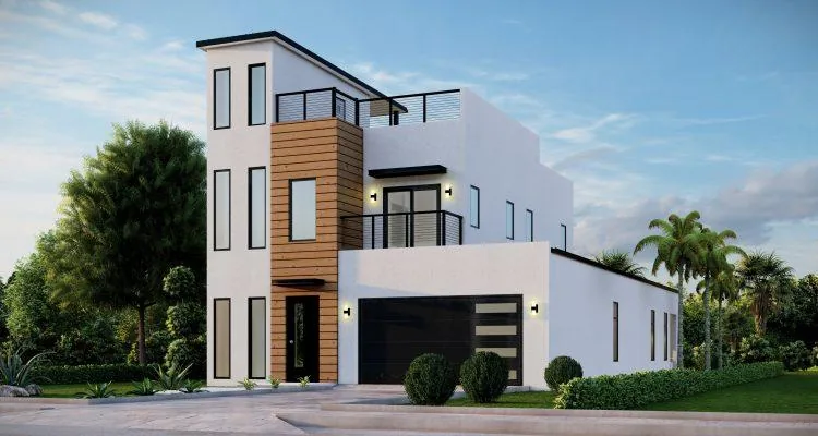 A white house with a garageDescription automatically generated