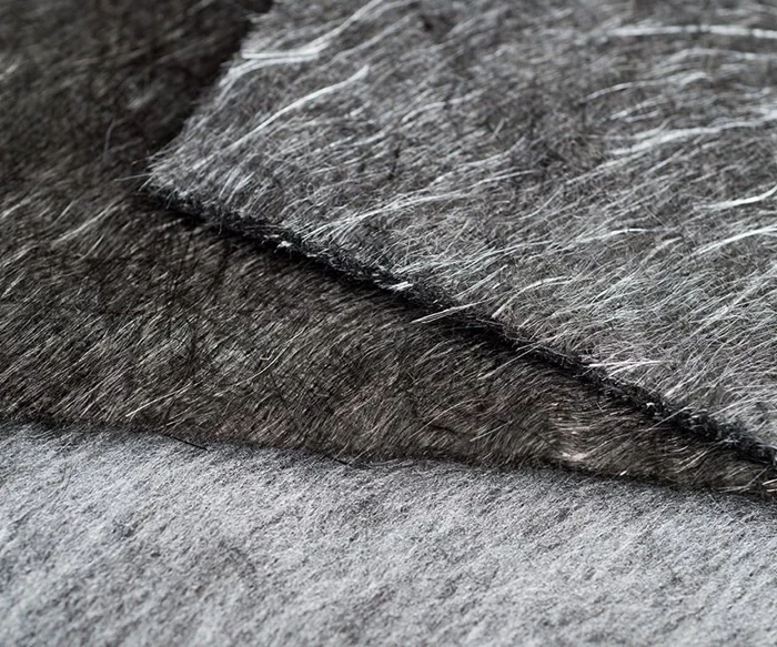 Recycled carbon fiber mat showing randomly oriented de-sized filaments