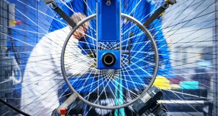 A close up of a bicycle wheelDescription automatically generated