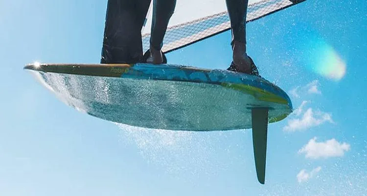 A person on a surfboardDescription automatically generated