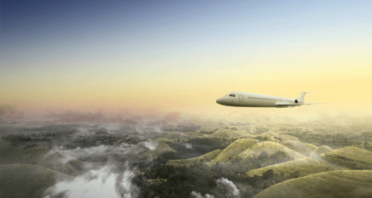 A plane flying over a landscapeDescription automatically generated