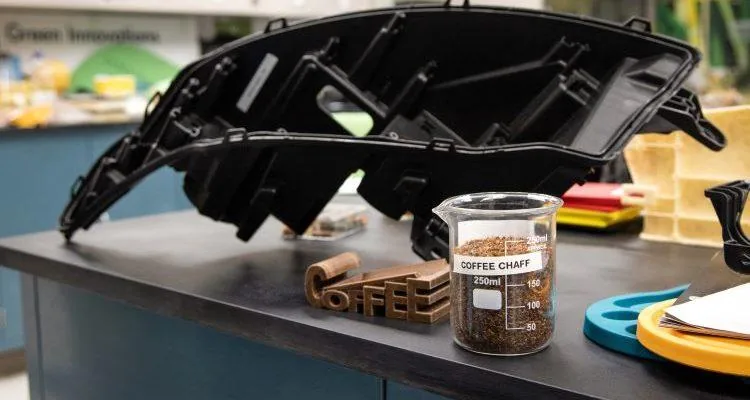 A measuring cup and a container of coffeeDescription automatically generated