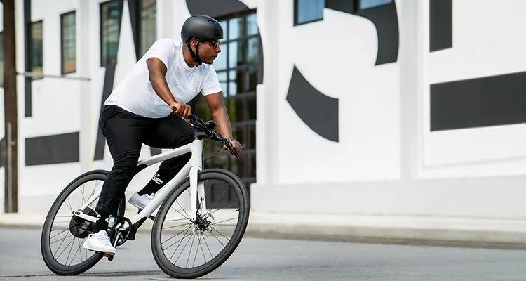 A person riding a bicycleDescription automatically generated