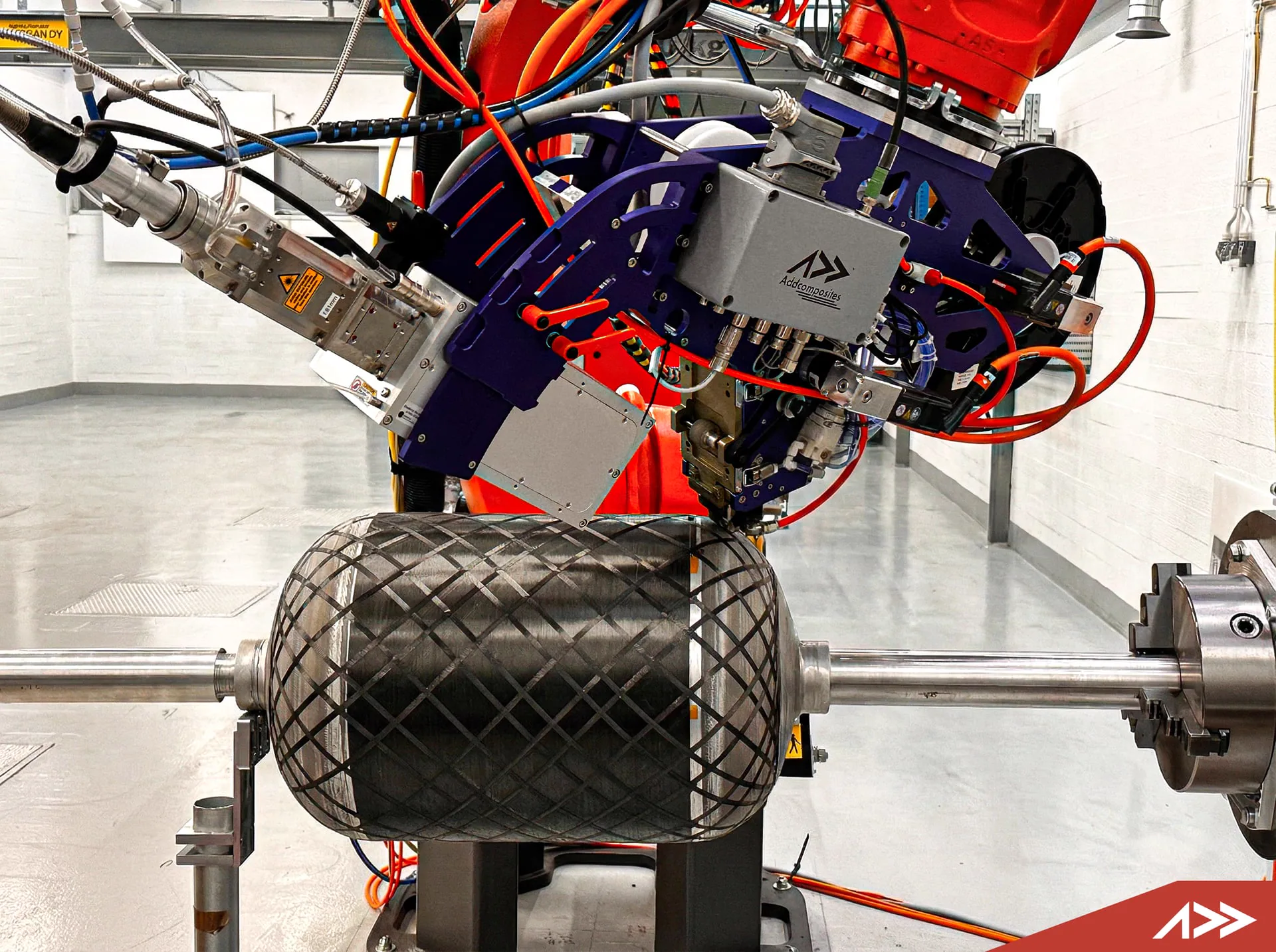 AFP-XS depositing continuous fiber conformally on a curved surface