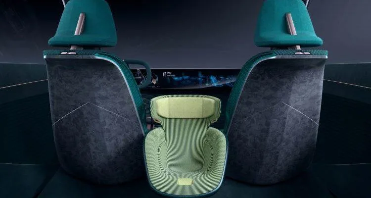 A car seat with green fabricDescription automatically generated with medium confidence
