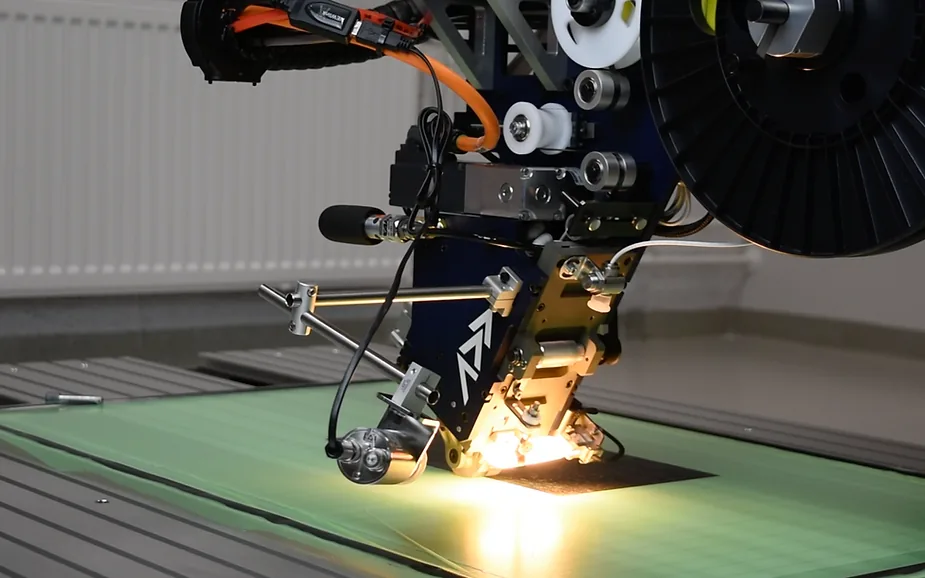 Automated Fiber placement system laying continuous fiber tapes