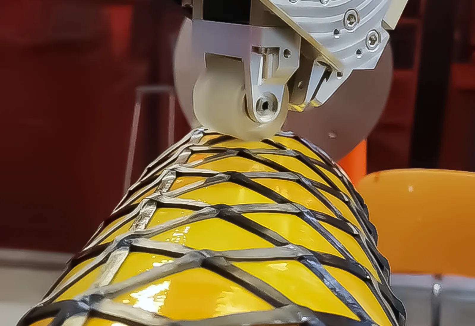 Automated helical composite winding for cylindrical launch hardware