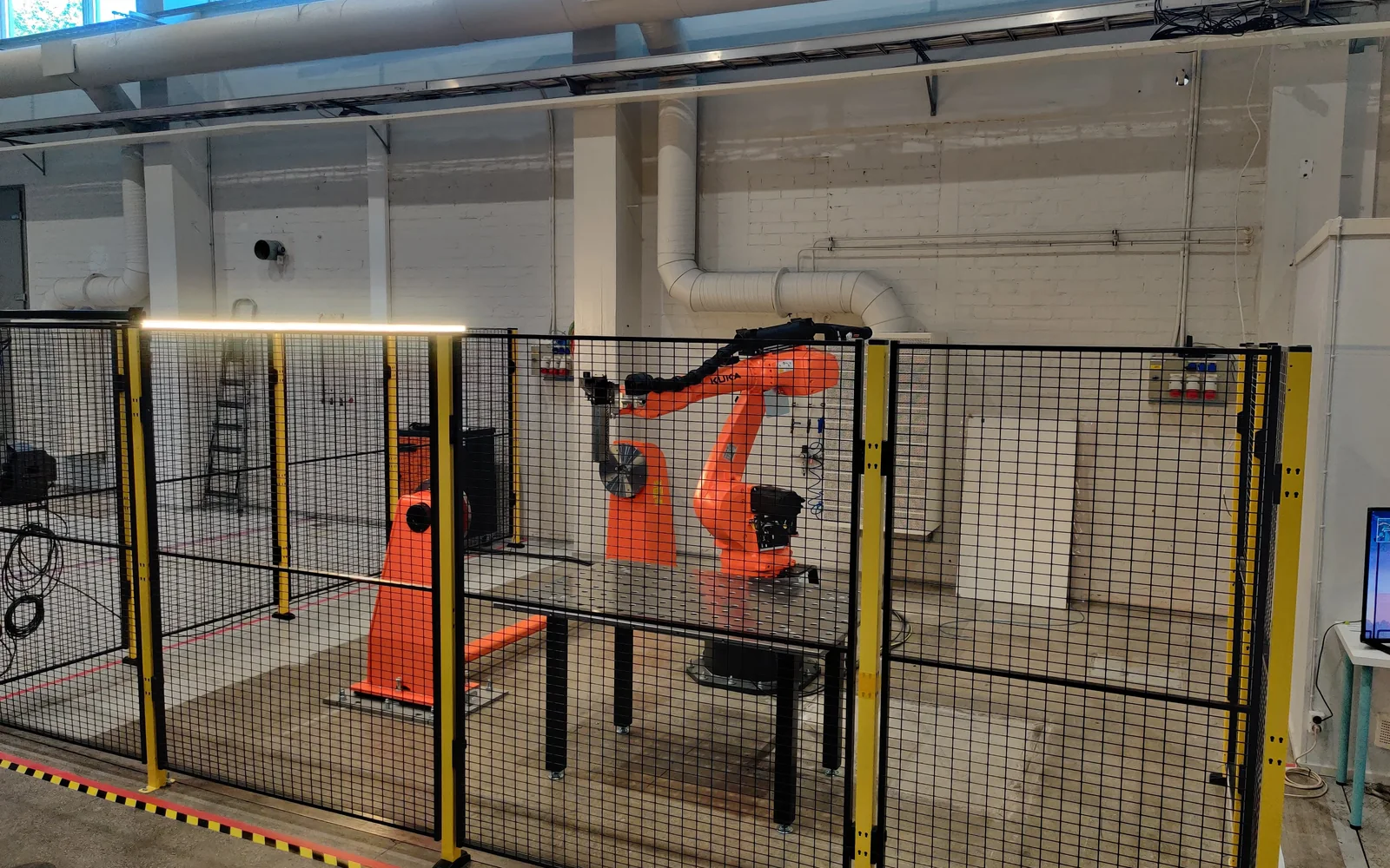 A working AddCell robotic composite production system on the factory floor