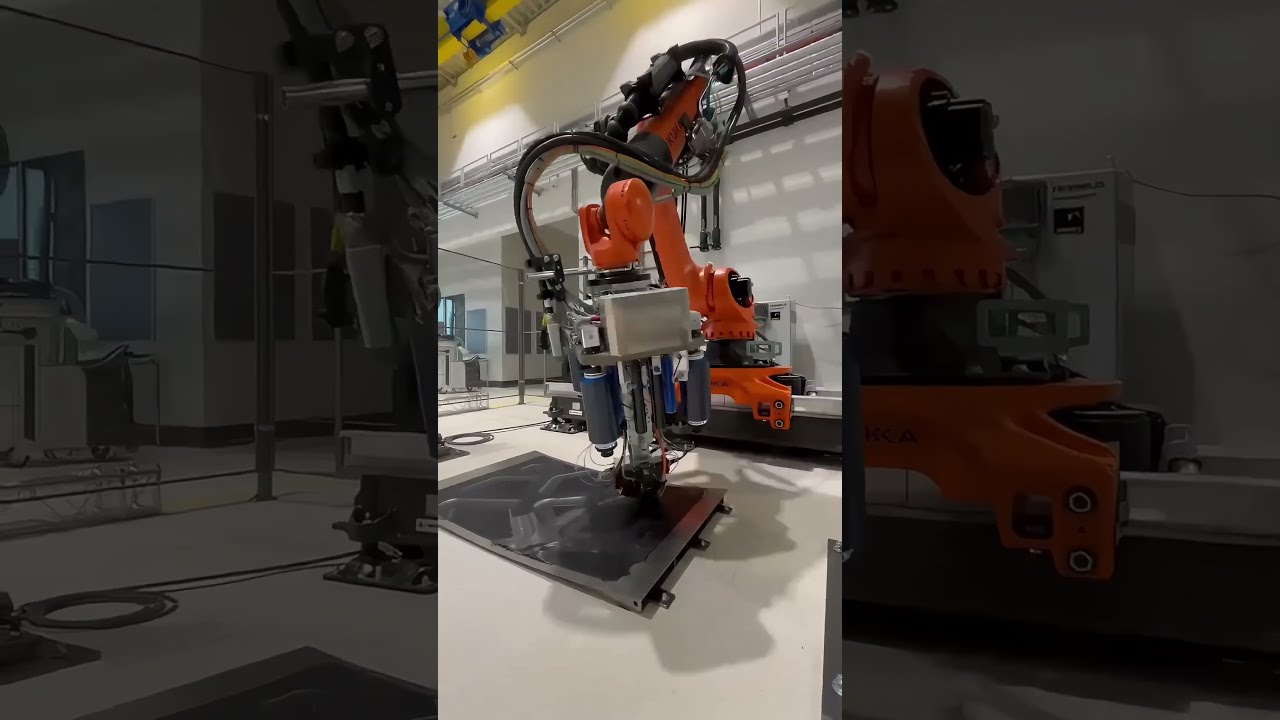 KUKA robot manufacturing a grid-stiffened composite fuselage panel